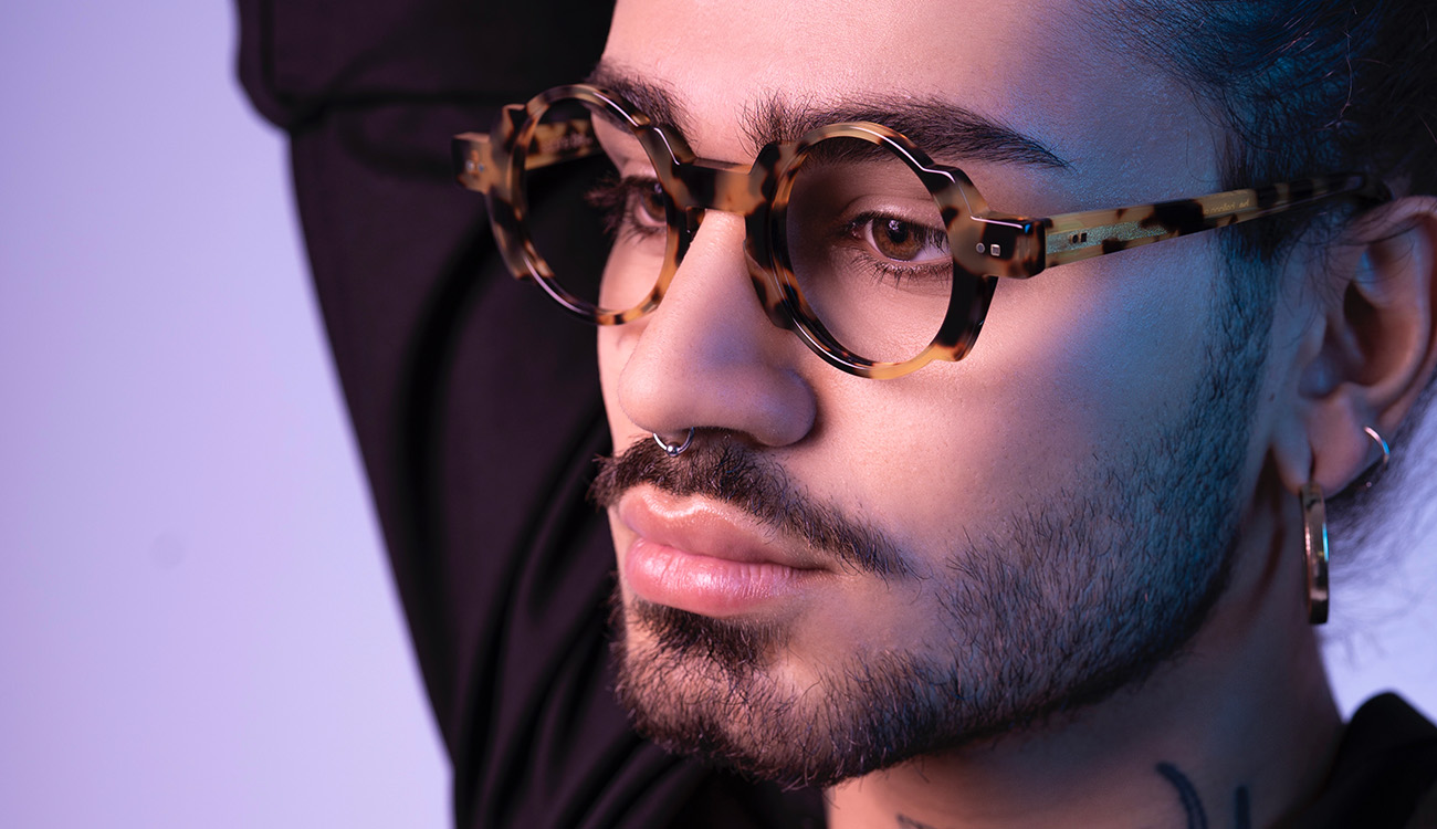 Man with brown framed glasses closeup