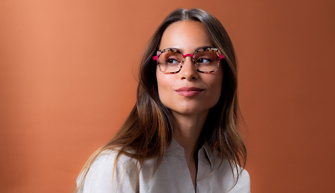 Woman on brown background with glasses