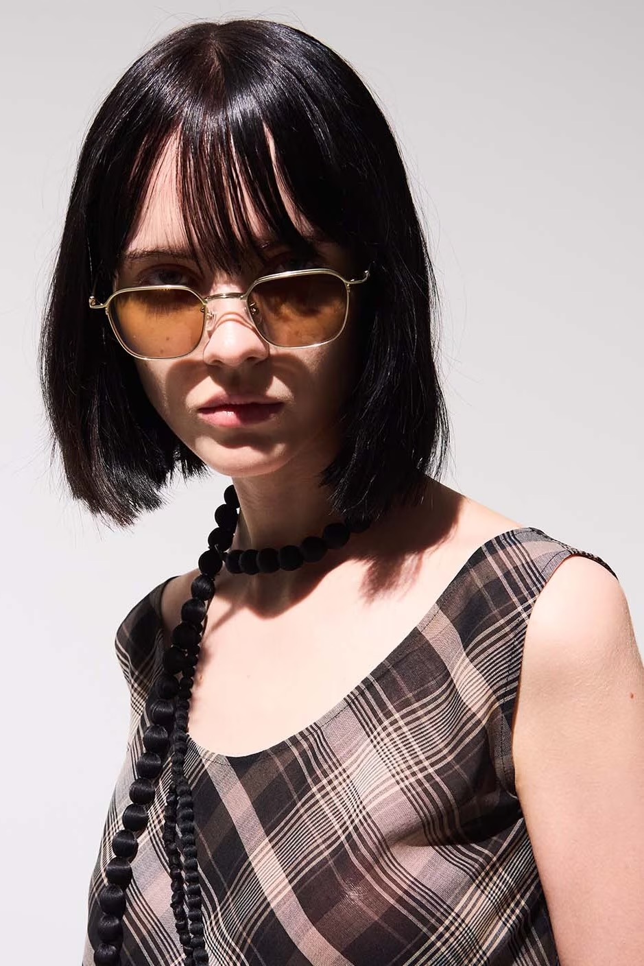 Yohji Yamamoto female model sulking with sunglasses